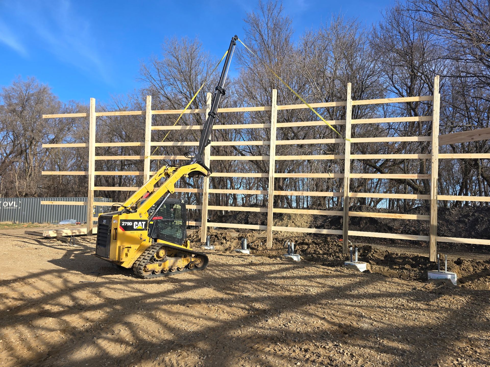 Frame wall standing during pole barn construction